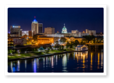 Downtown Montgomery skyline at sunset near Roses RV River Resort